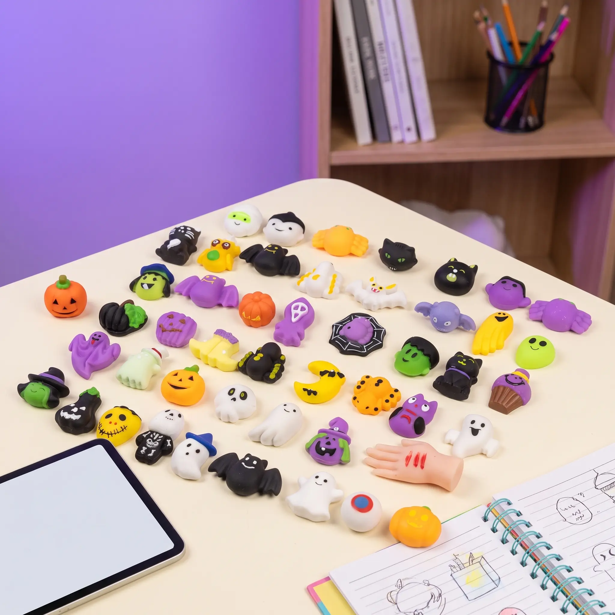 Random assortment of Halloween mini squishies displayed on a desk