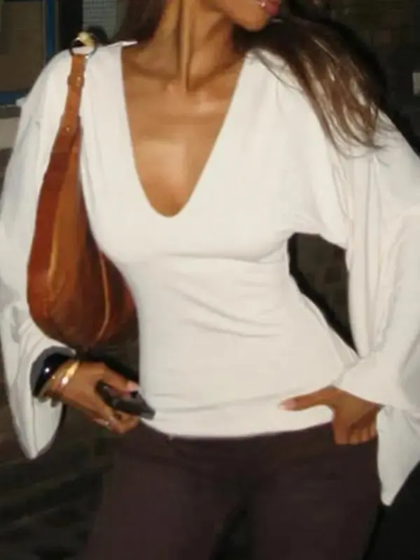 Elegant women's solid-color long-sleeved T-shirt, featuring a sexy deep V-neck and a slim-fit design