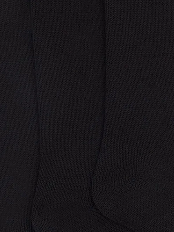 A three-piece set of black long socks