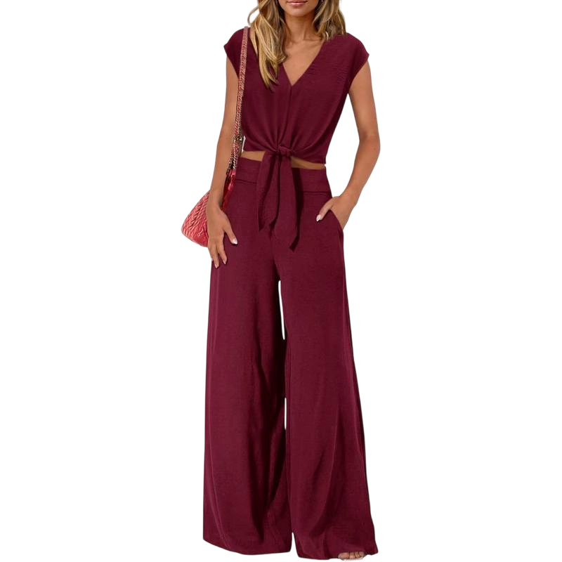 Women's two-piece tracksuit: short-sleeved V-neck cropped top with tie and wide-leg pants.