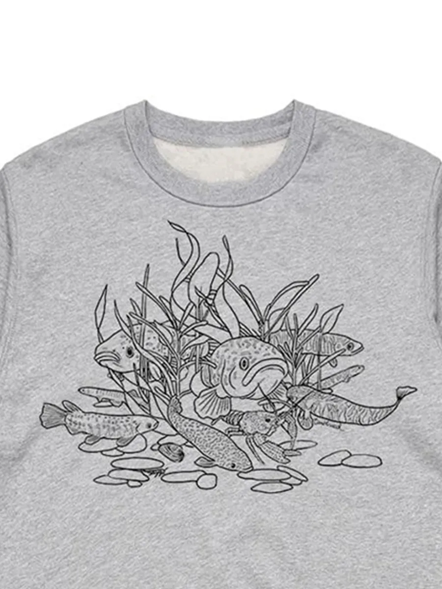 A versatile sports shirt featuring a simple pattern of freshwater fishs
