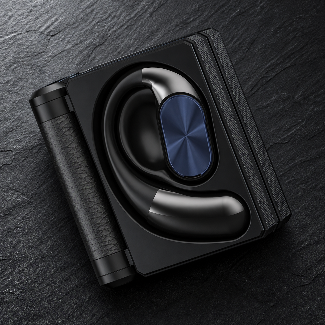 Black earbud seated in its shaped charging compartment