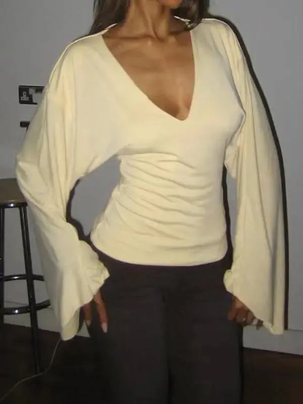 Elegant women's solid-color long-sleeved T-shirt, featuring a sexy deep V-neck and a slim-fit design