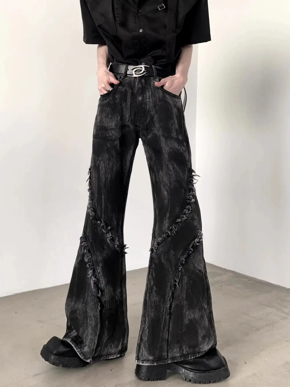 Distressed Flared Jeans With Frayed Seams