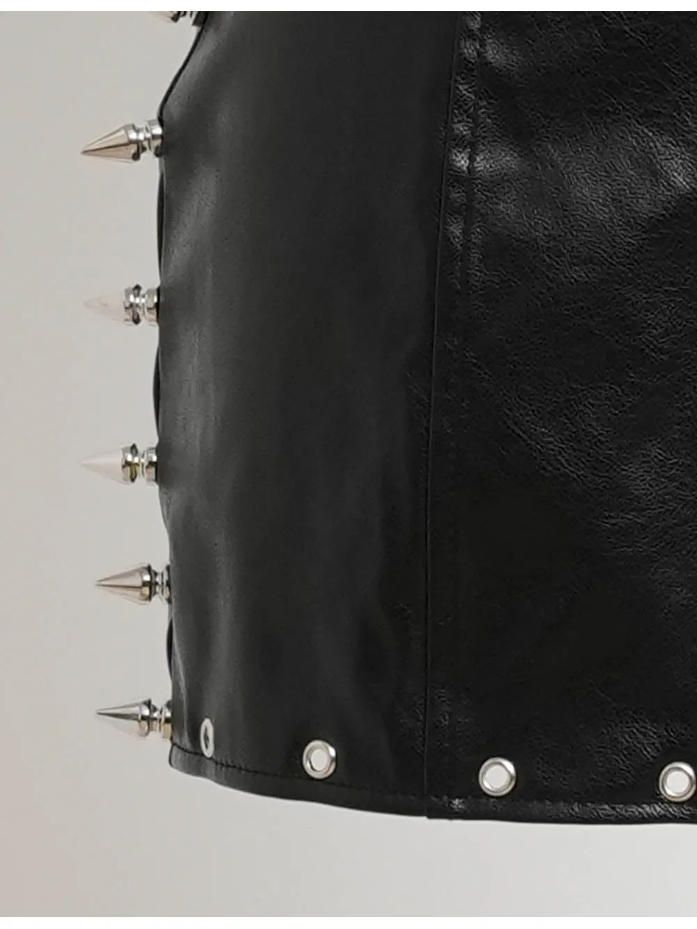 Metal Eyelet Stud Solid Color Faux Leather Mini Skirt