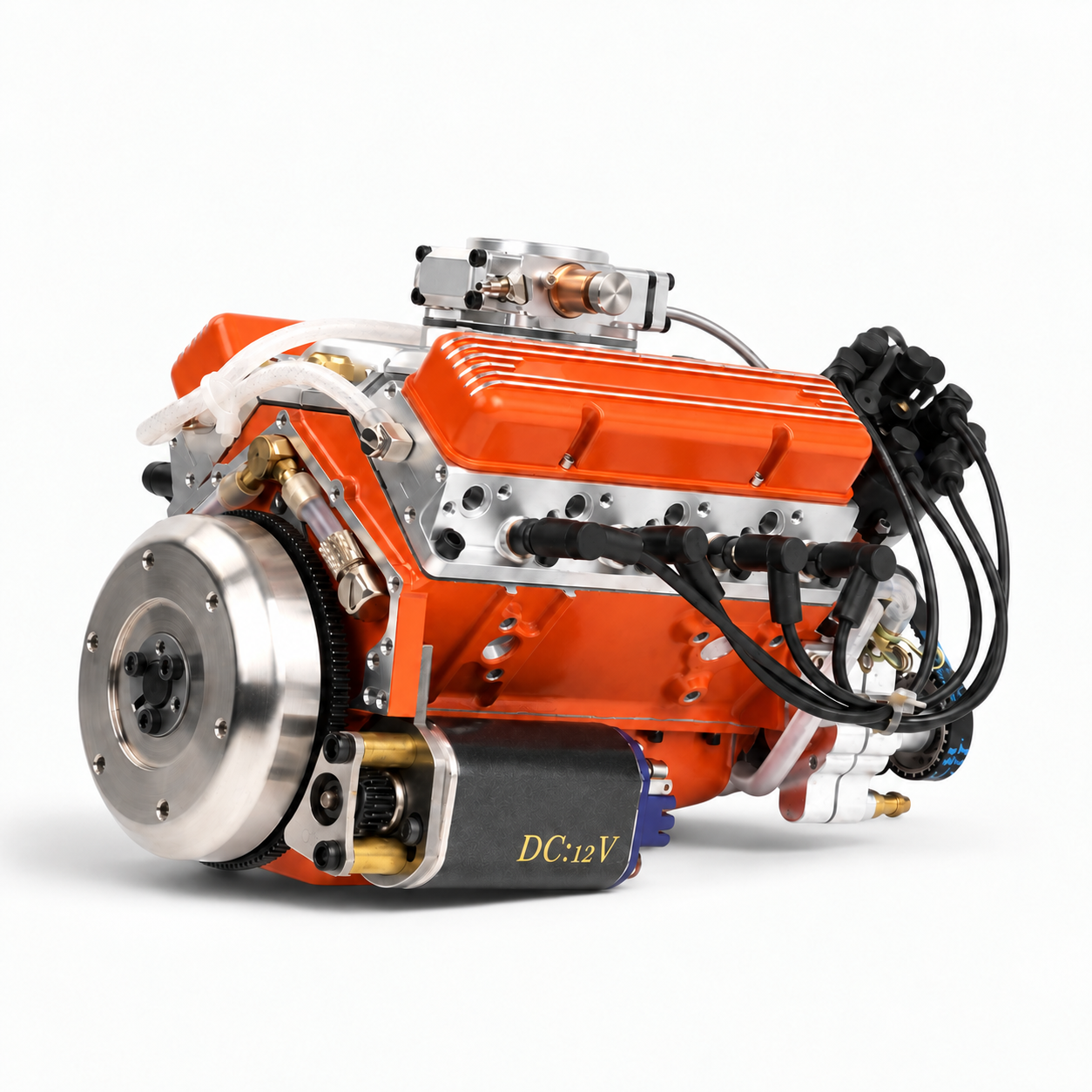 Assembled orange 44cc miniature V8 engine with flywheel, starter motor, hoses and ignition wiring