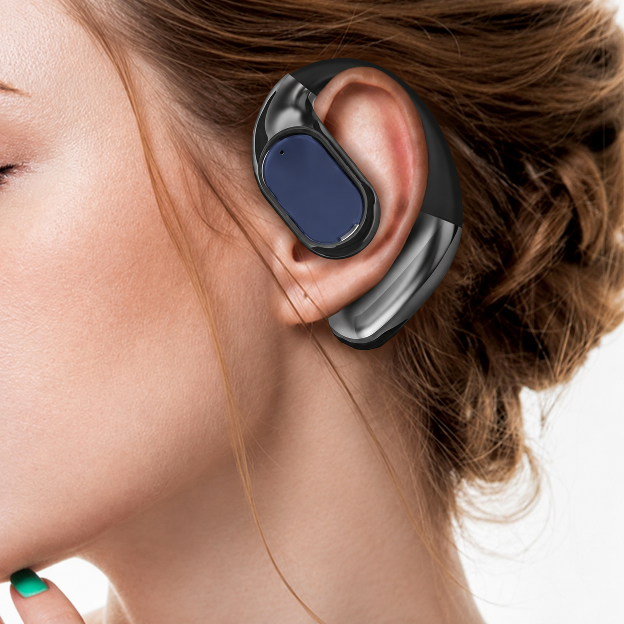 Close-up showing how the black ear hook sits around the outer ear
