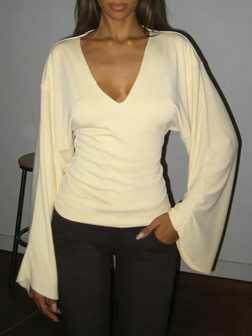 Elegant women's solid-color long-sleeved T-shirt, featuring a sexy deep V-neck and a slim-fit design
