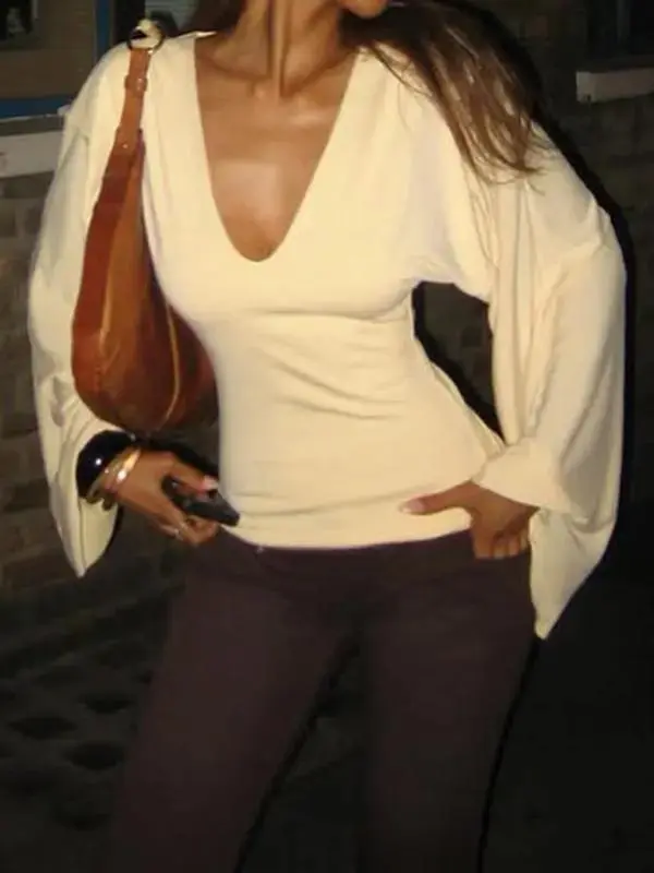 Elegant women's solid-color long-sleeved T-shirt, featuring a sexy deep V-neck and a slim-fit design