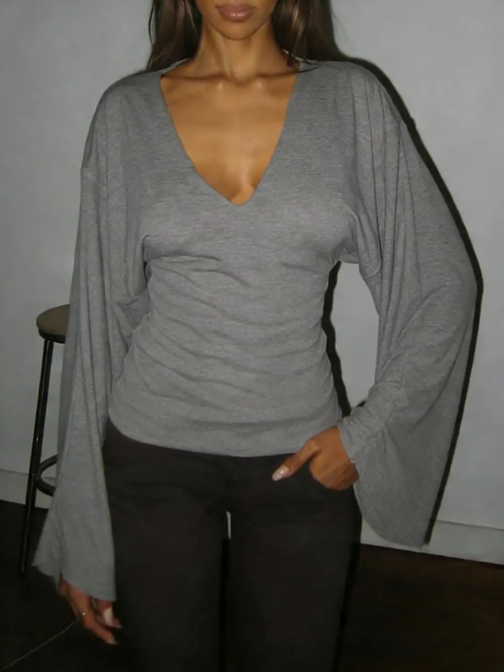 Elegant women's solid-color long-sleeved T-shirt, featuring a sexy deep V-neck and a slim-fit design