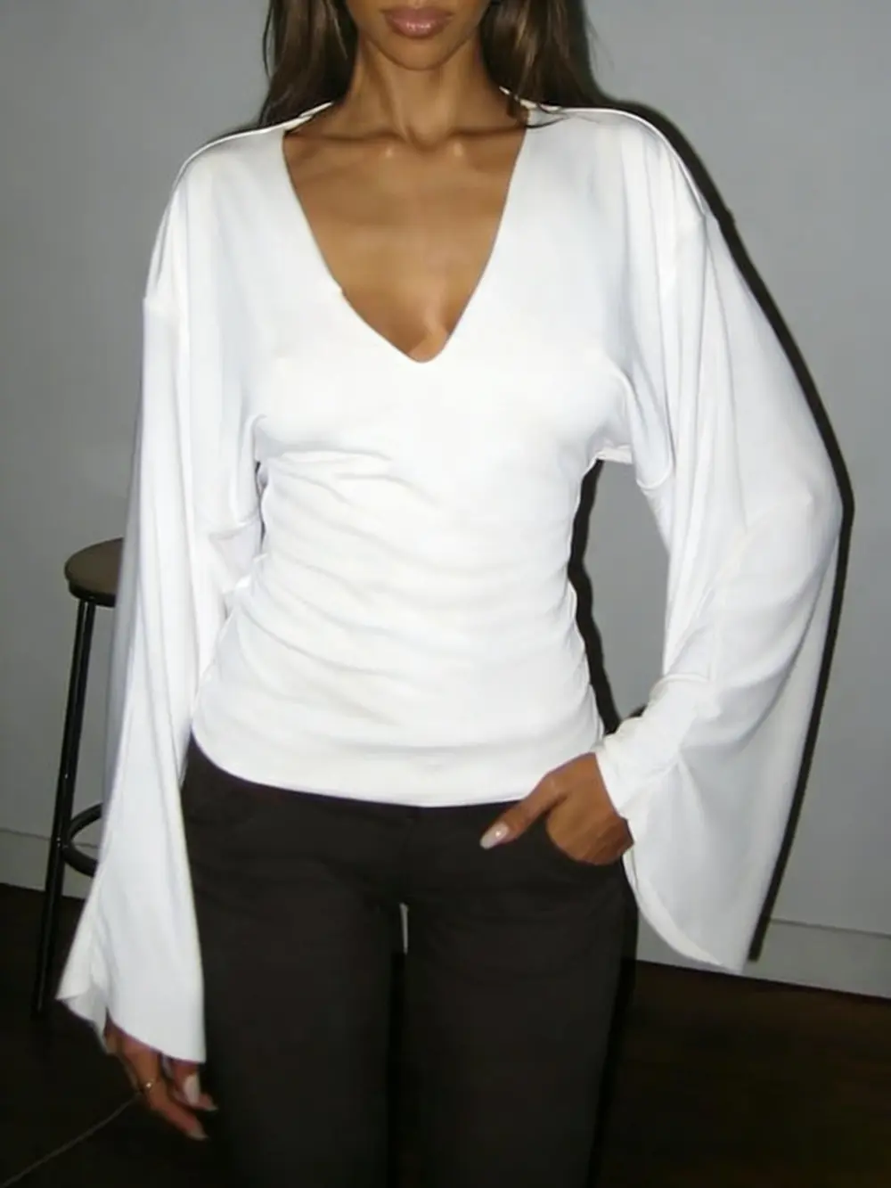 Elegant women's solid-color long-sleeved T-shirt, featuring a sexy deep V-neck and a slim-fit design