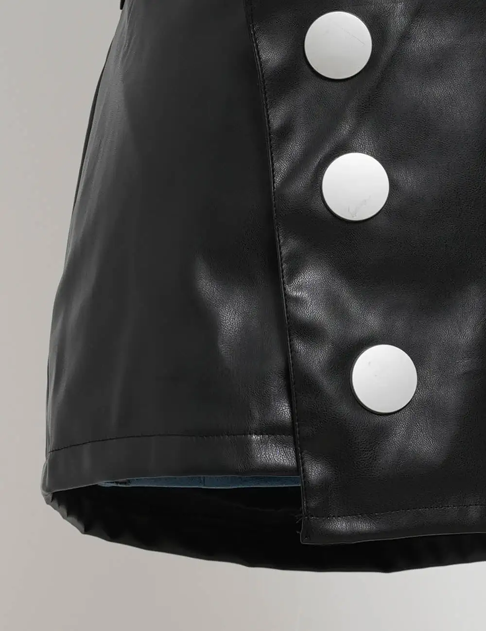 Faux Leather Metal Button Irregular Warp Mini Skirt