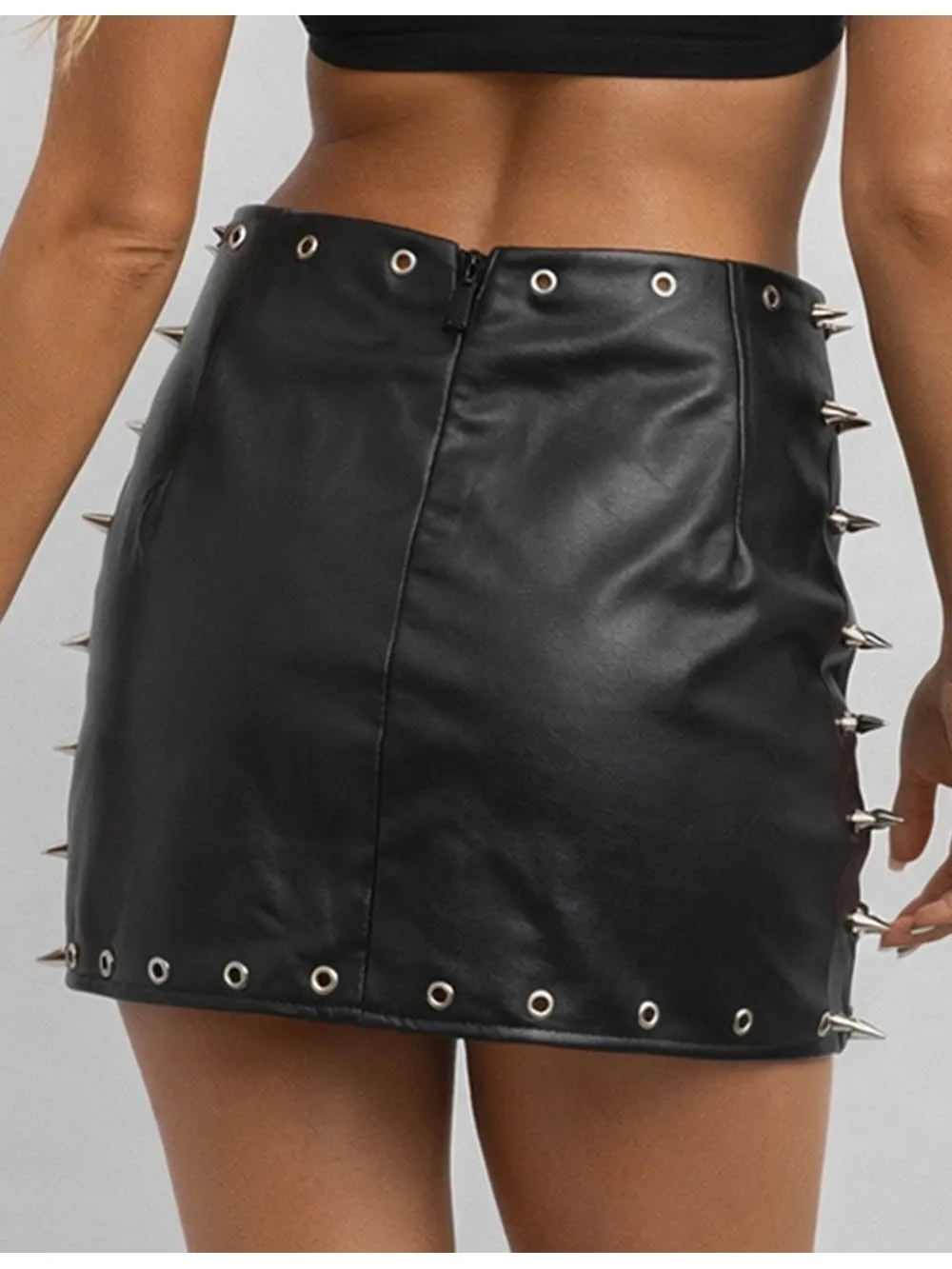 Metal Eyelet Stud Solid Color Faux Leather Mini Skirt